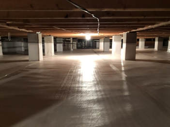Dark, fully encapsulated crawl space with thick moisture barrier and wrapped piers.